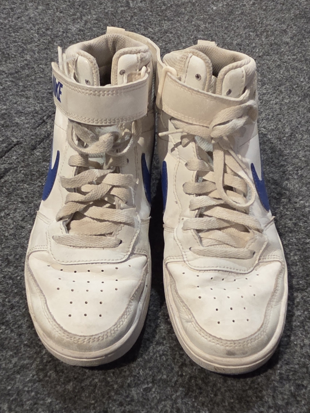 Nike White High-Top Sneakers with Blue Swoosh